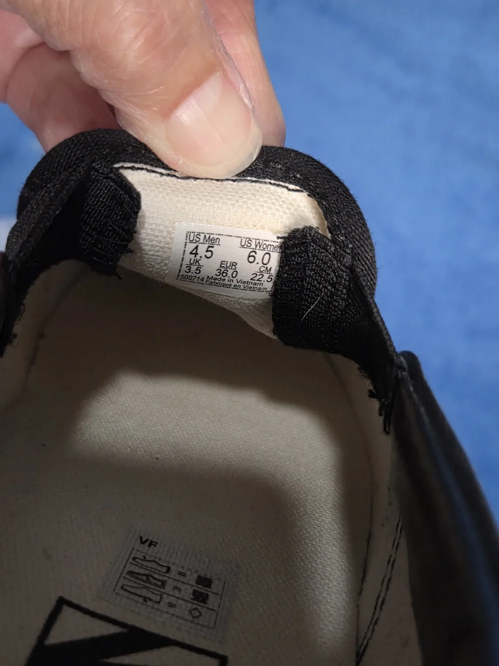 Vans Slip-On Skate Shoes in Black & White with Red Logo Print